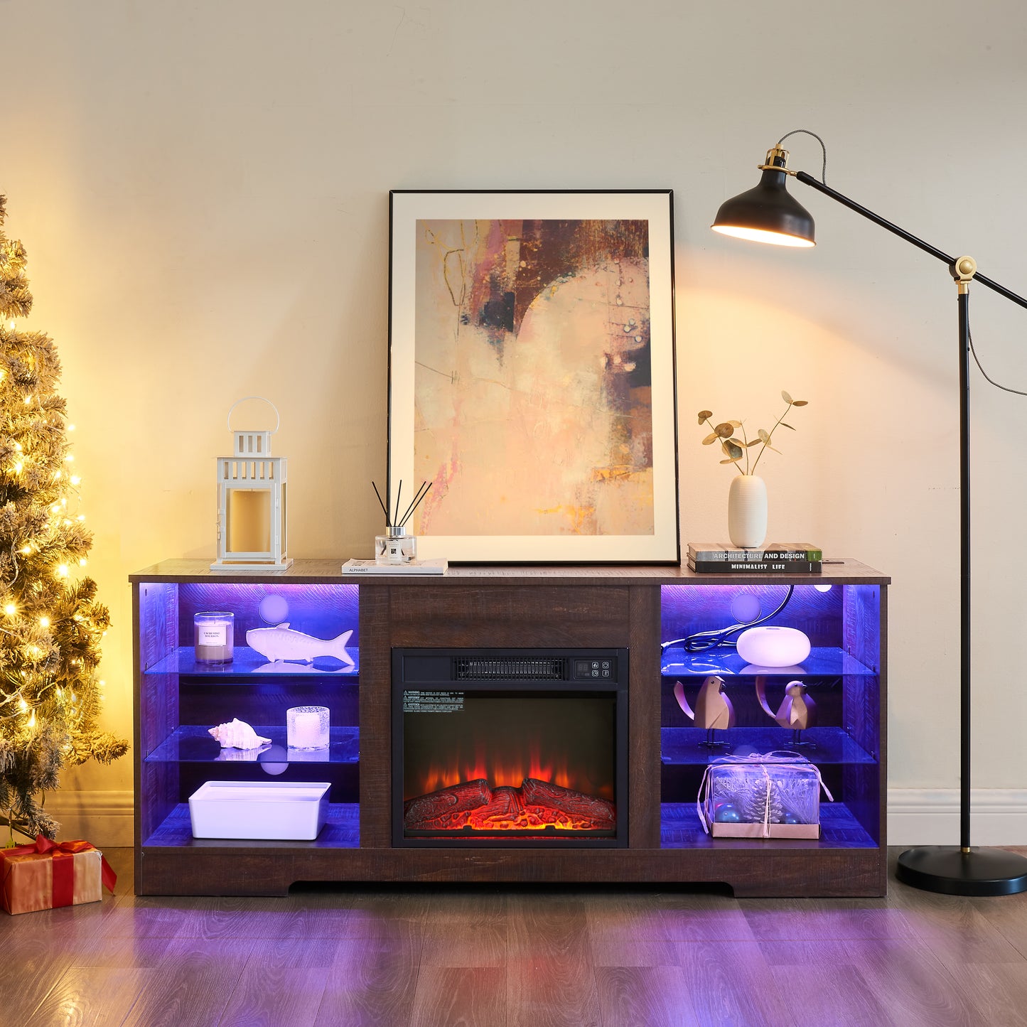 Dark wood media console with electric fireplace blue LED lights and decorative items