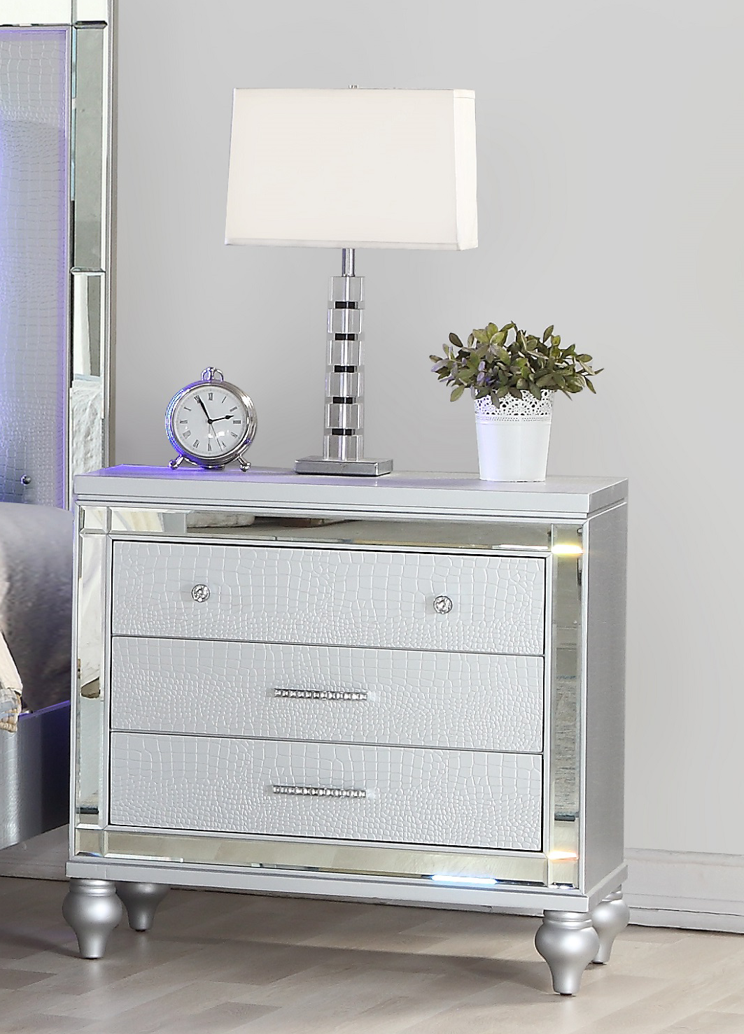 Silver mirrored drawer nightstand with embossed crocodile pattern and crystal knobs