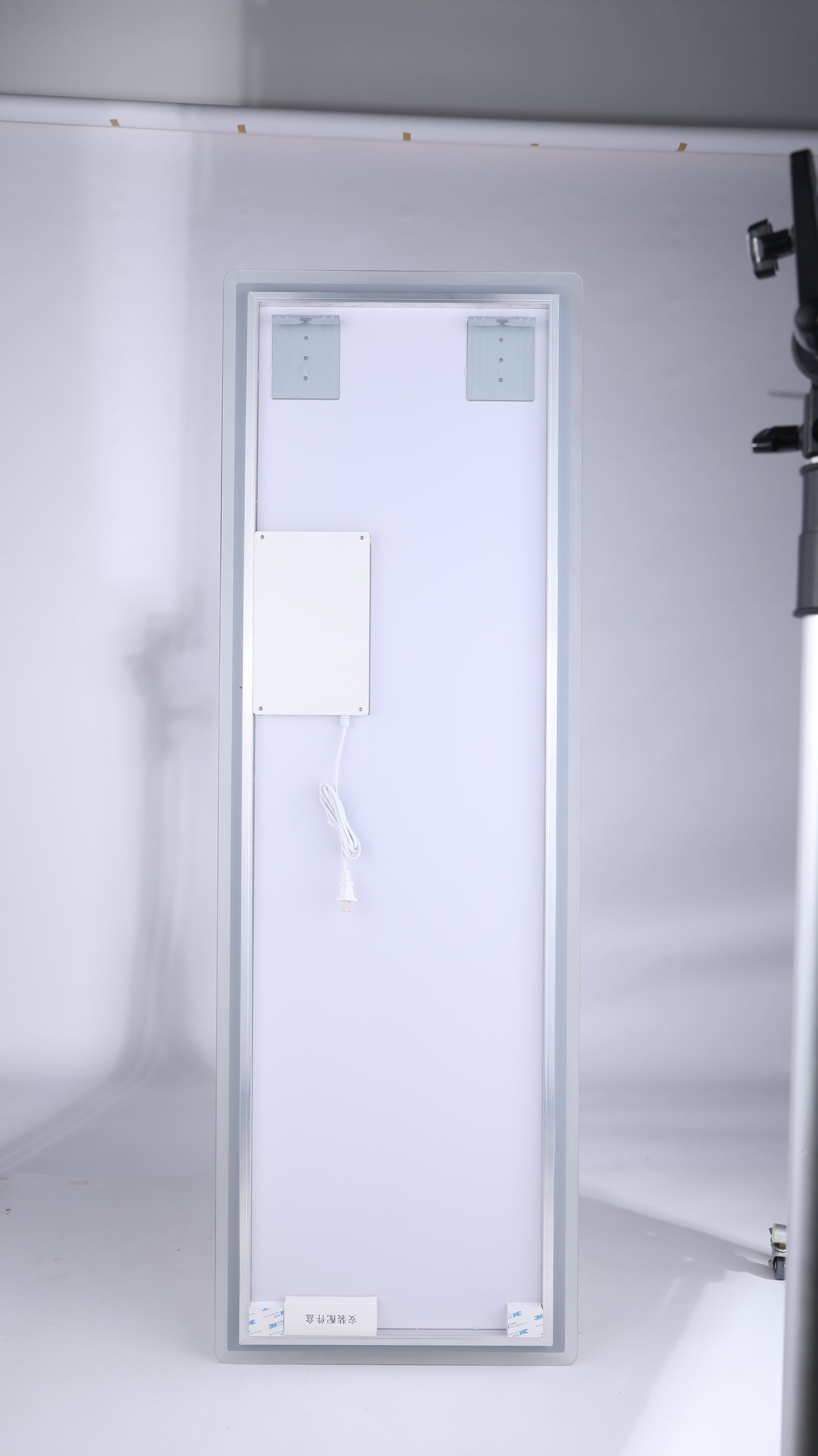 Slim LED light panel with mounting brackets and integrated power cord