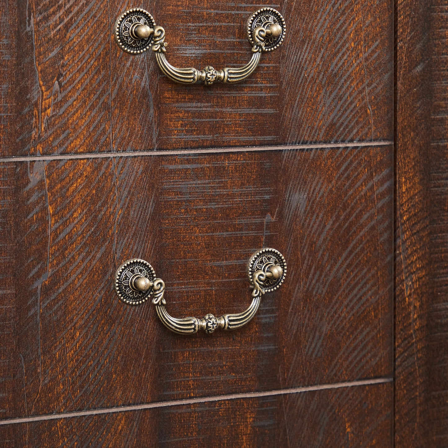 Dark wood dresser with antique brass ornate drawer pulls