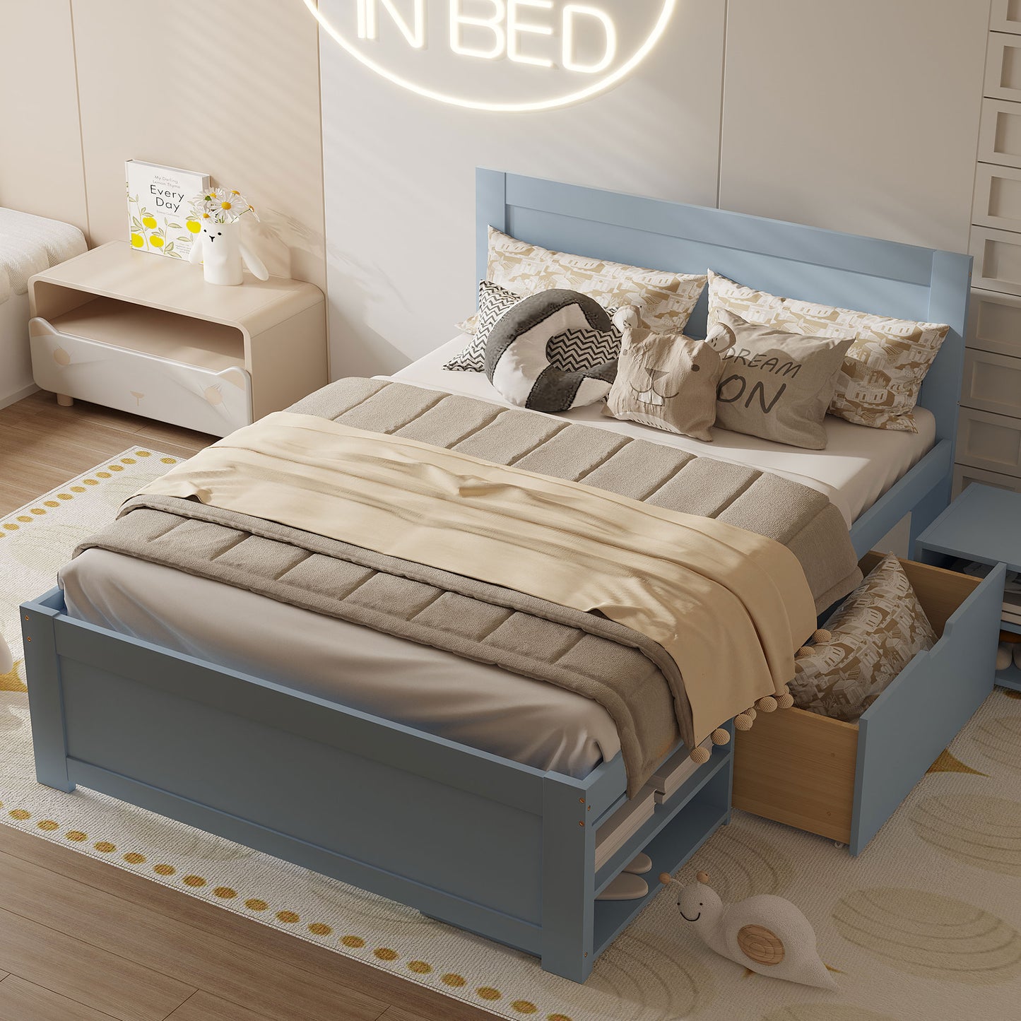 Powder blue wooden twin bed frame with storage drawers and playful pillows