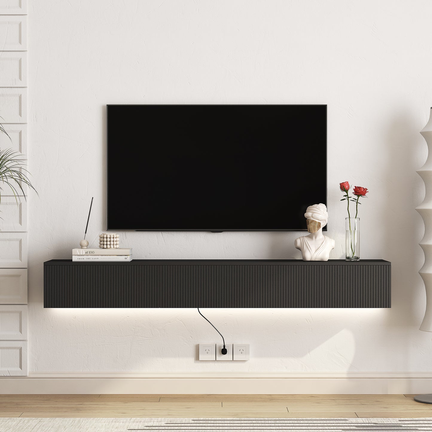 Modern black media console with ribbed front and LED lighting for TV setup