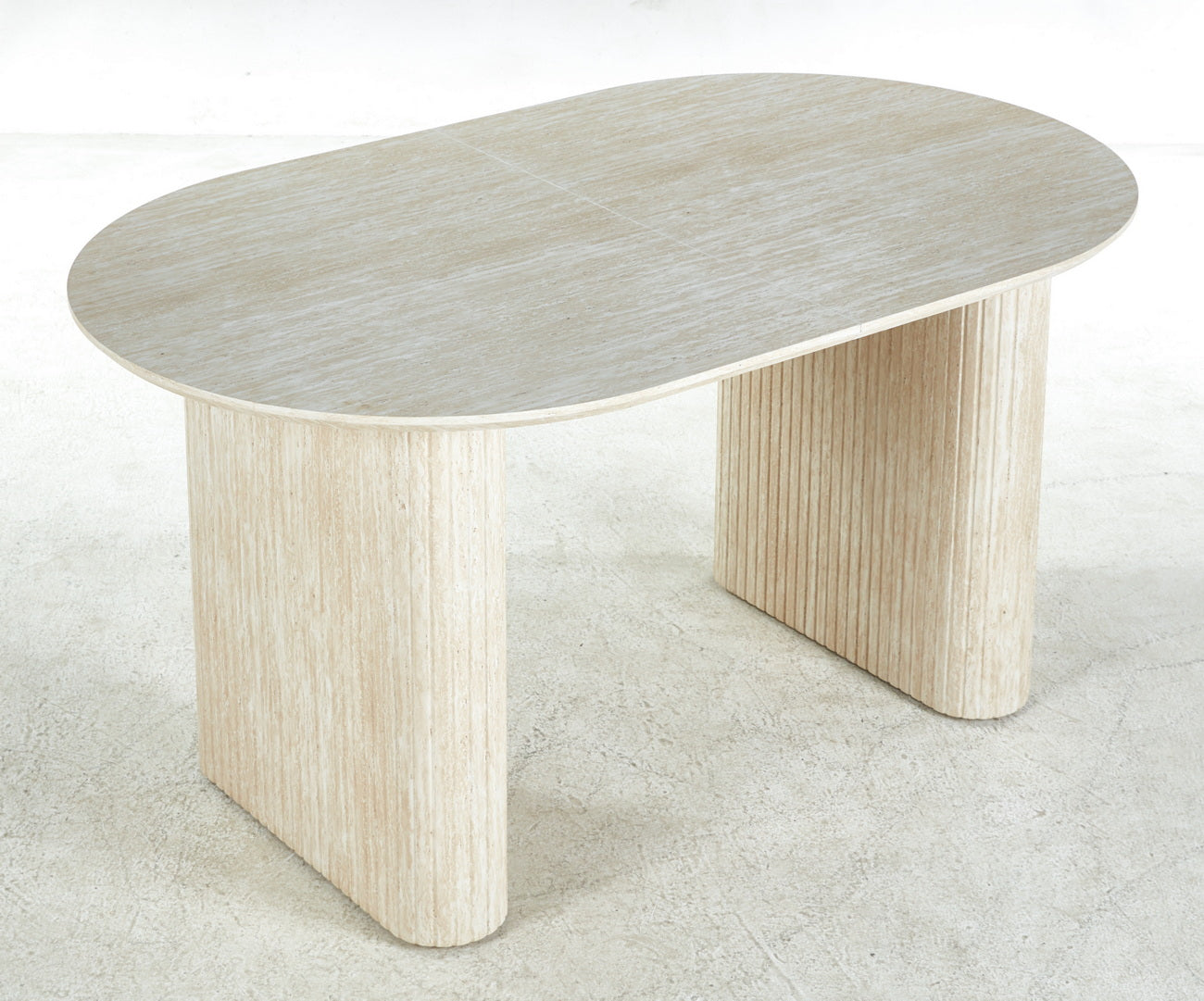 Travertine oval coffee table with fluted pedestal legs and a natural stone finish