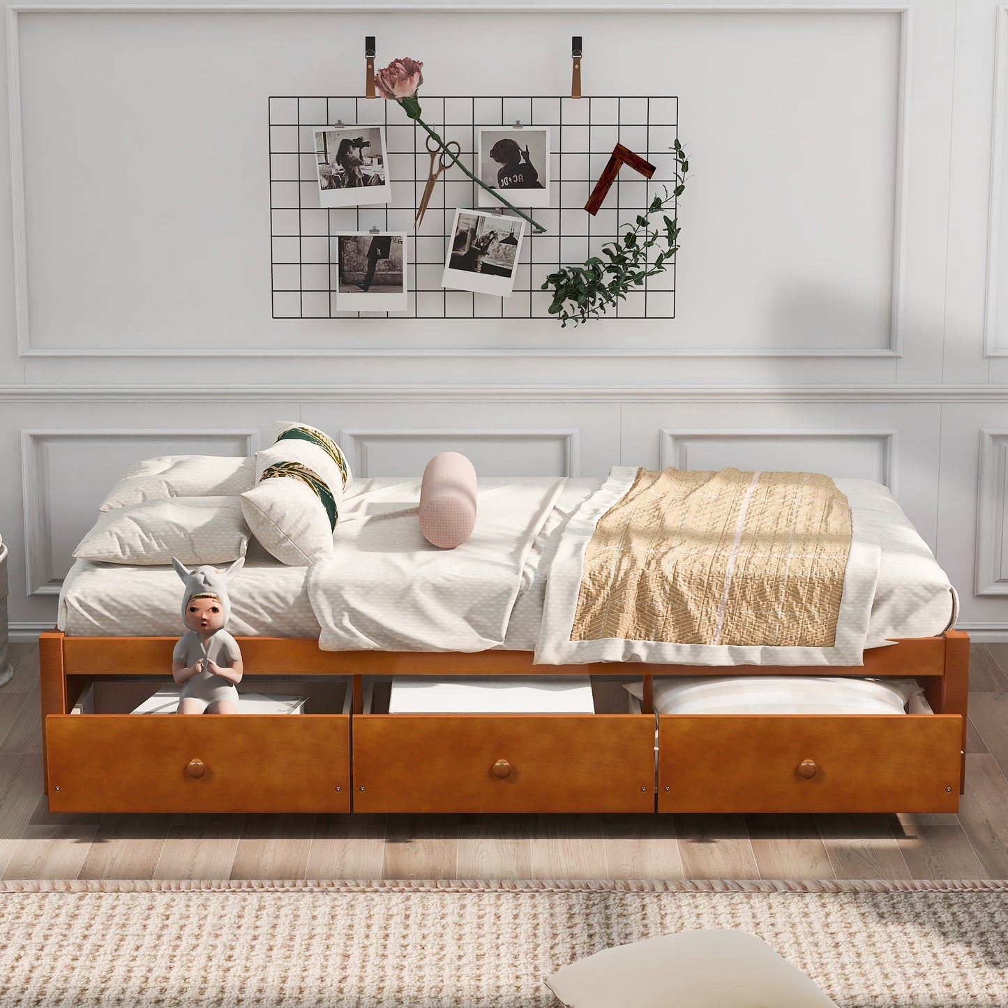 Wooden daybed with three storage drawers in a warm honey finish