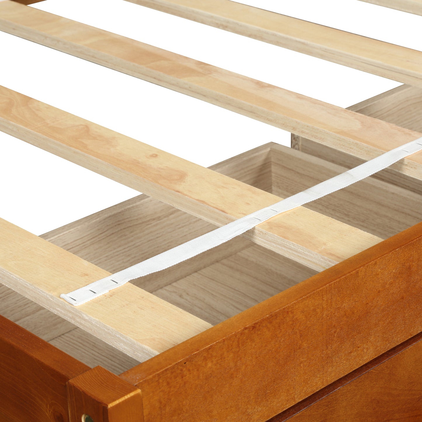 Closeup of natural wood slat bed frame with white support strap emphasizing durability for mattress support
