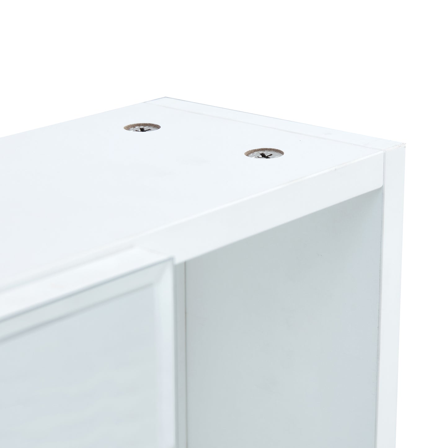 White cabinet corner showing predrilled screw holes for assembly