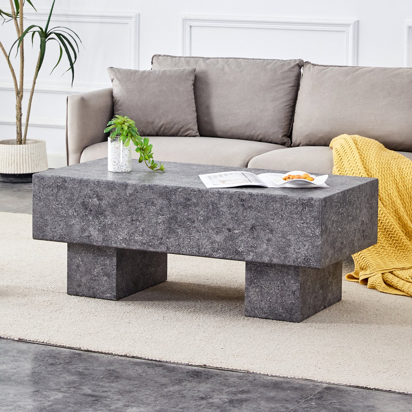 Dark gray rectangular concrete coffee table with a minimalist design