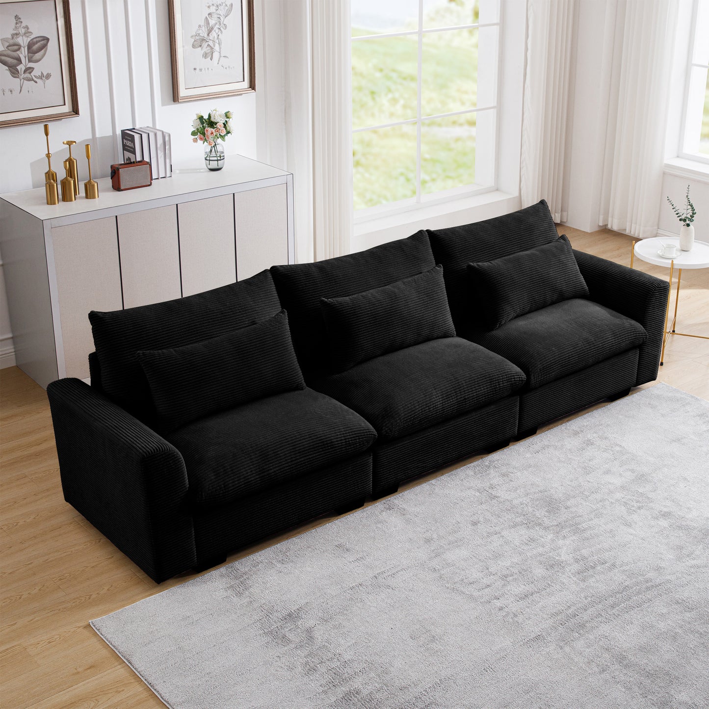 Black corduroy sectional sofa with plush cushions perfect for a modern living room