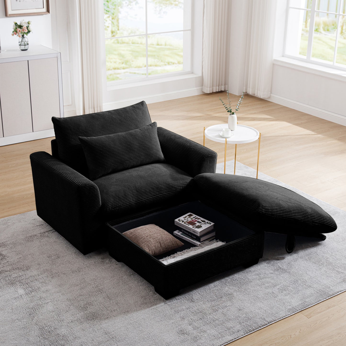 Black corduroy armchair with hidden storage and a pullout ottoman modern living room setup