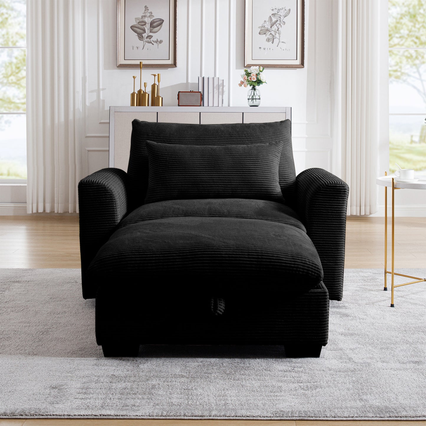 Black corduroy convertible chair with pullout ottoman and matching pillow