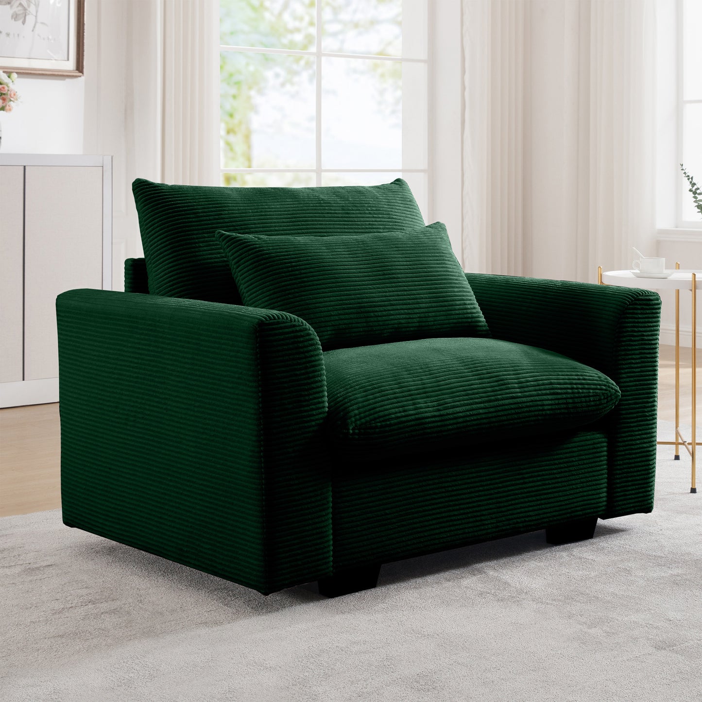 Emerald green corduroy accent chair with plush cushions and square arms