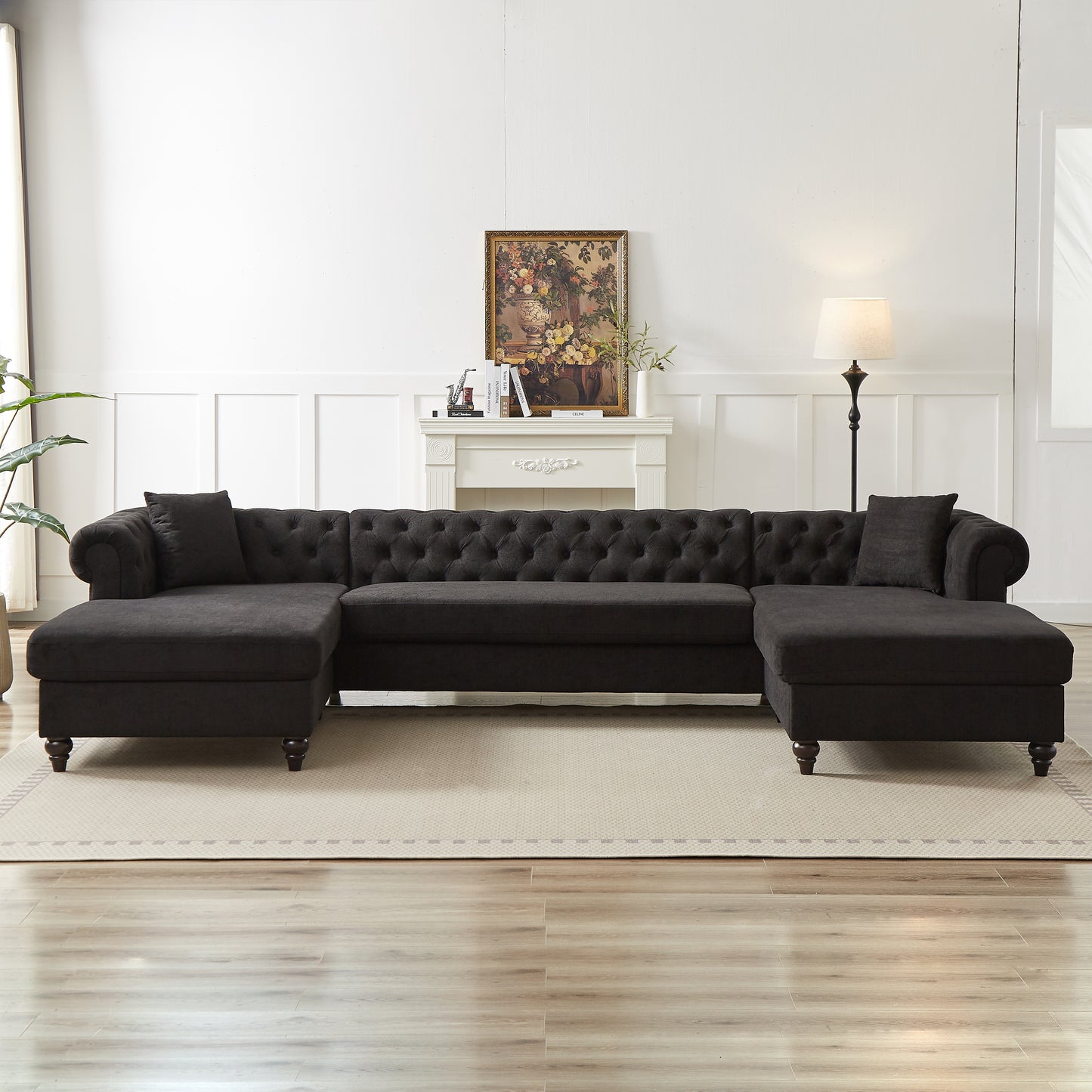 Dark gray tufted chesterfield sectional sofa with two chaise lounges ideal for modern living rooms