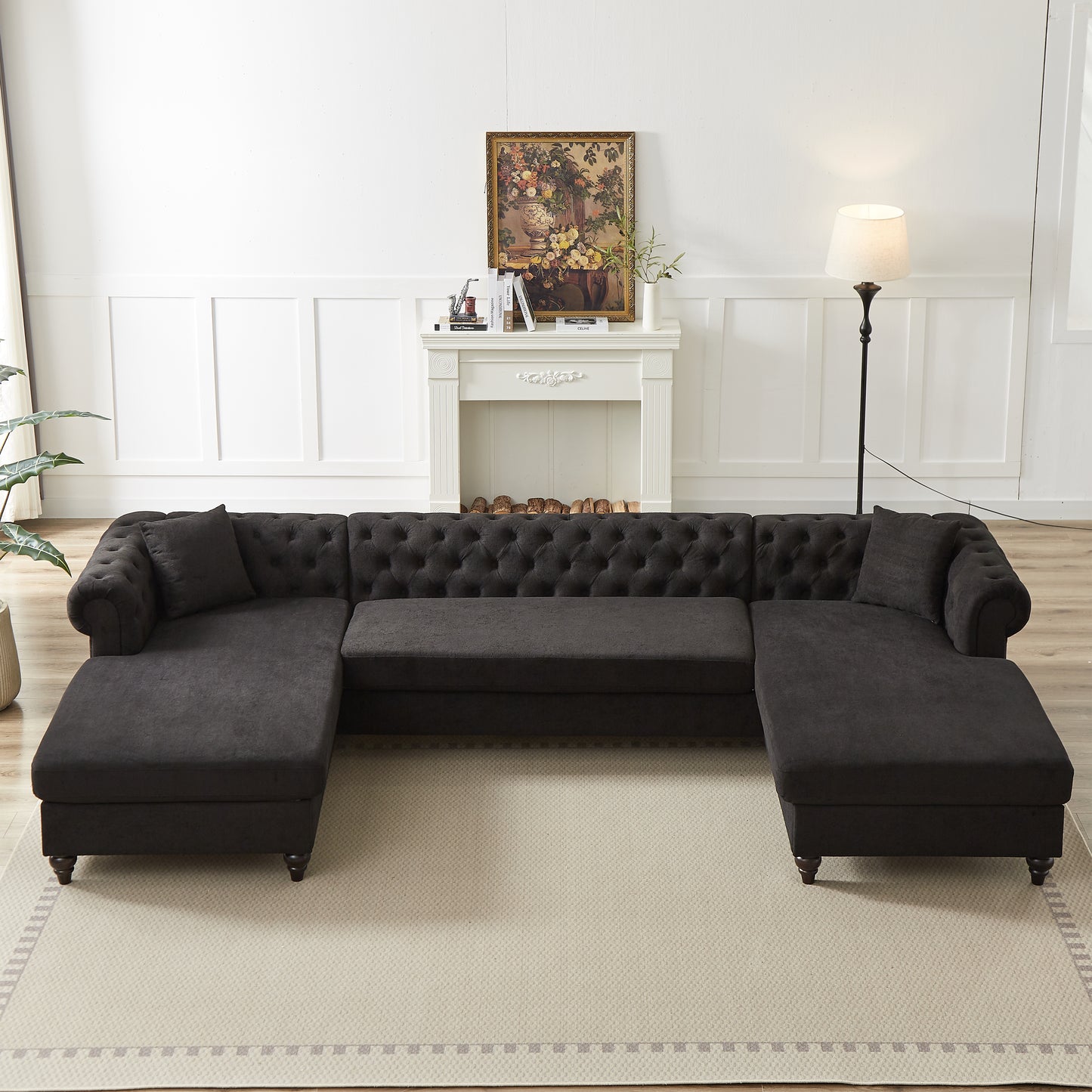 Dark charcoal tufted Ushaped sectional sofa with chaise loungers and plush cushions