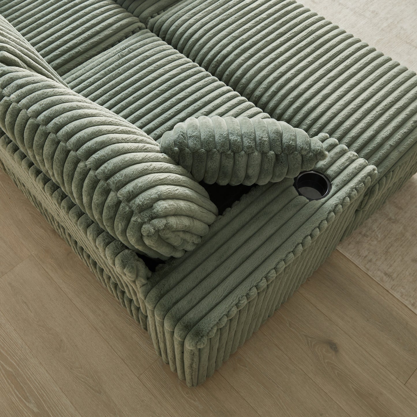 Sage green corduroy modular sofa section with plush throw pillows