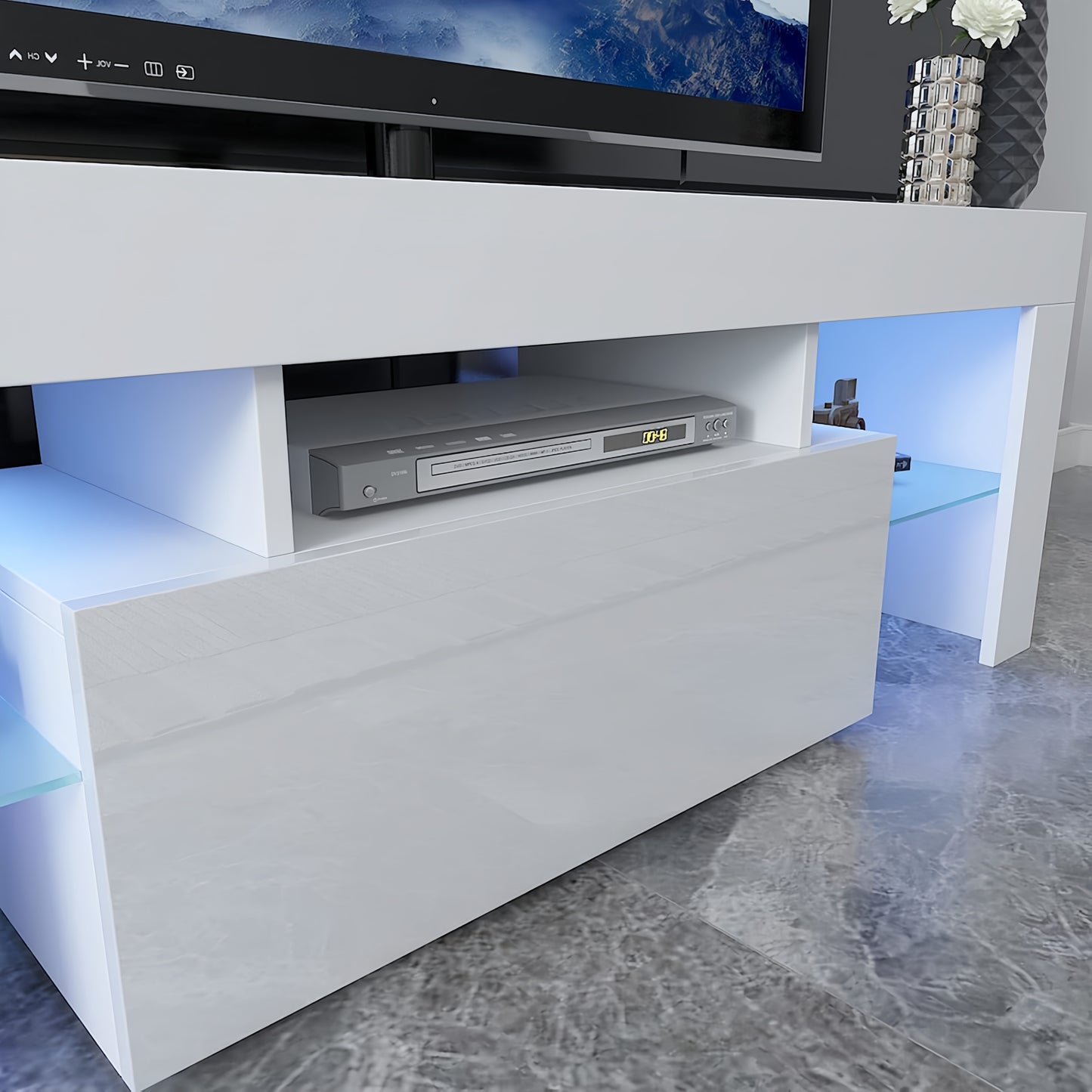 Modern white media console with LED lighting and DVD player compartment