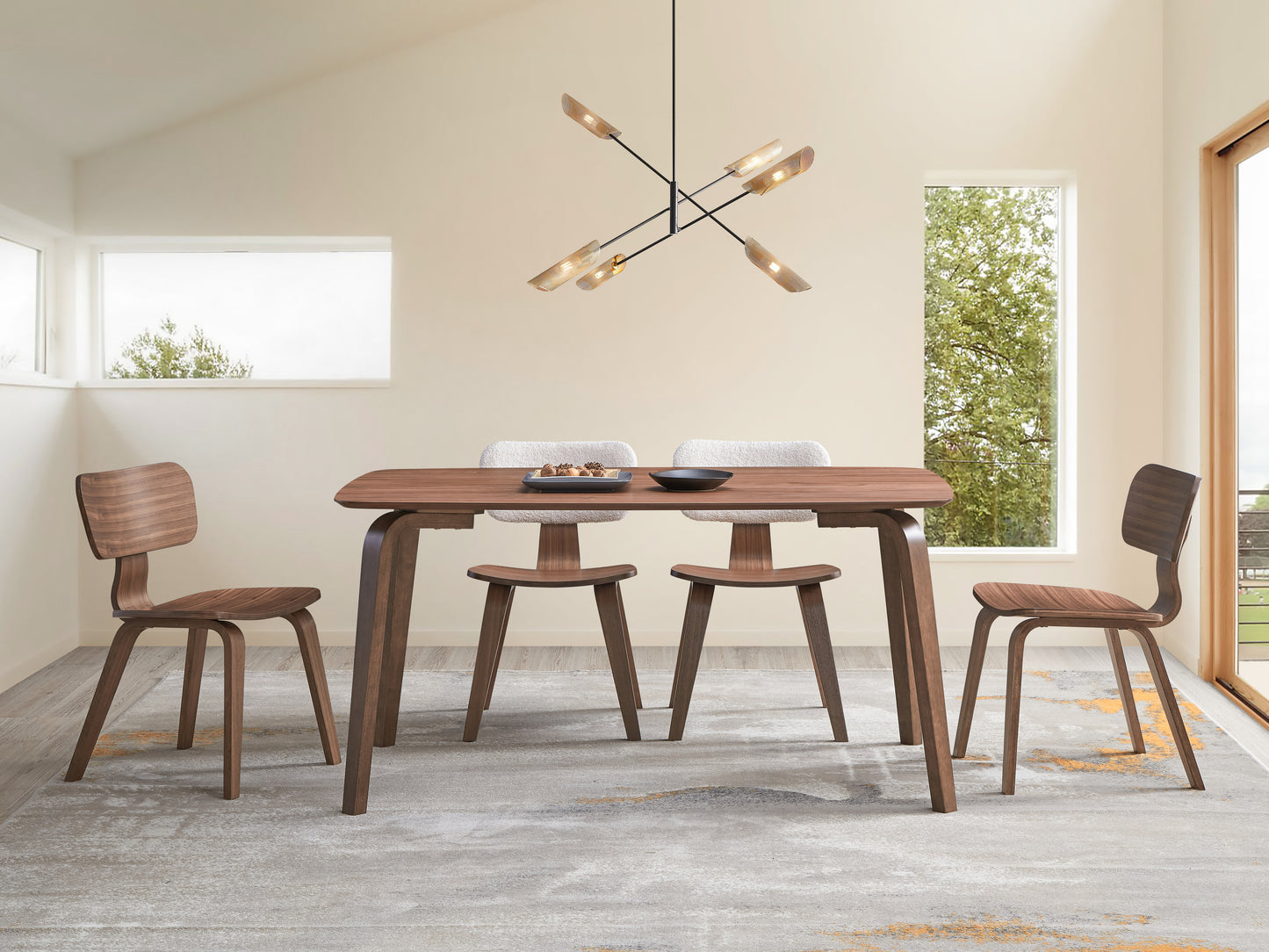 Modern walnut dining table with curved legs and matching chairs ideal for contemporary dining spaces