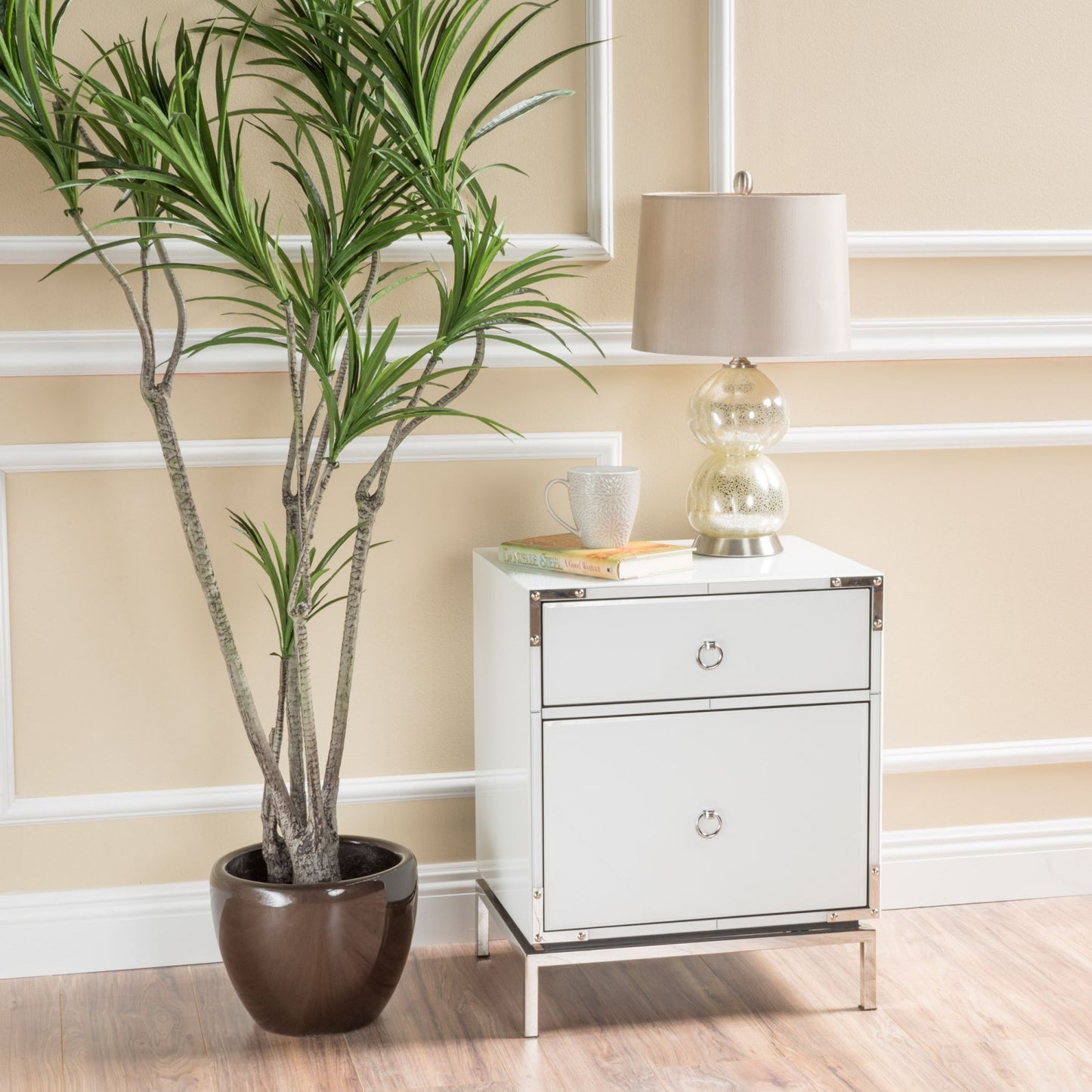 White mirrored nightstand with silver ring pulls and chrome legs