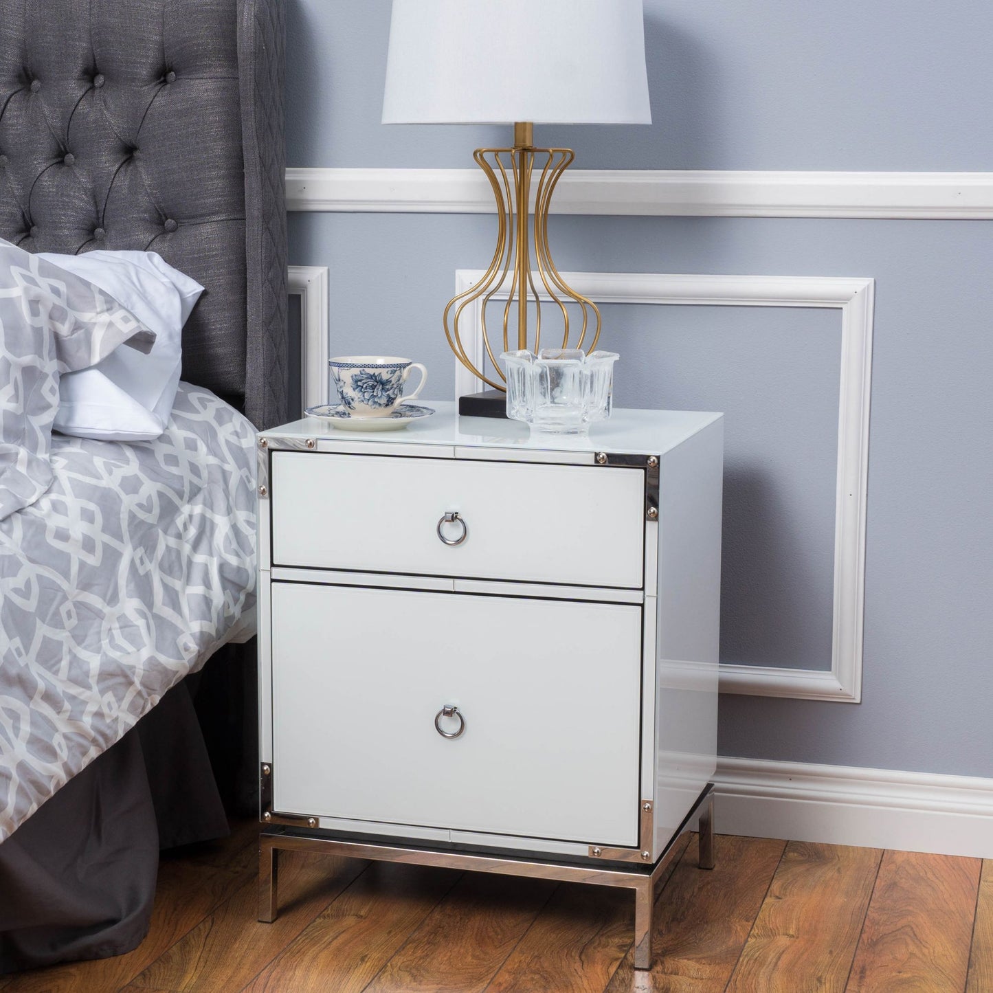 Modern white mirrored nightstand with silver hardware and two drawers