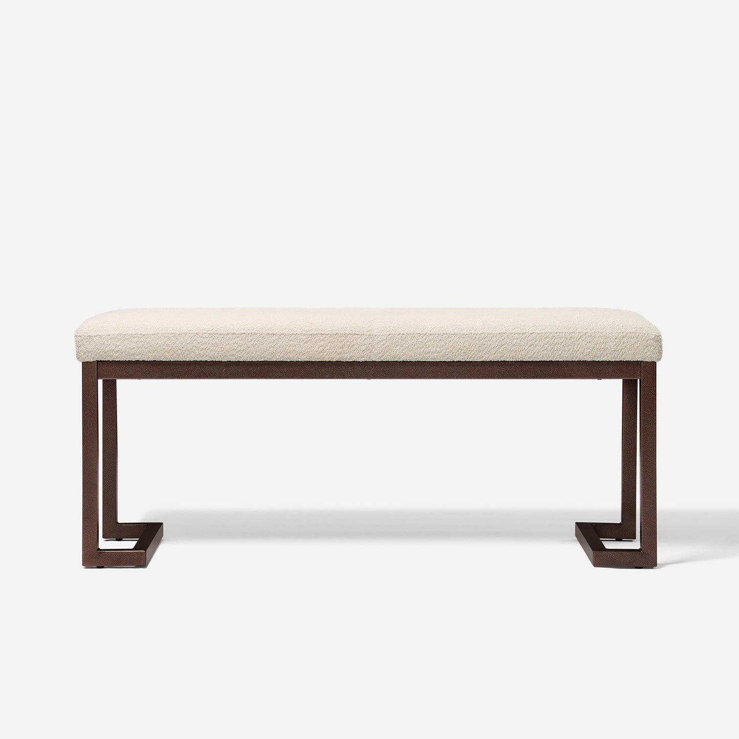 Cream boucle upholstered bench with dark bronze metal legs