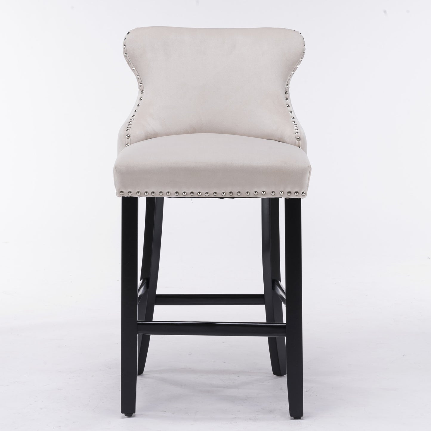 Tufted beige velvet bar stool with silver nailhead trim and black legs