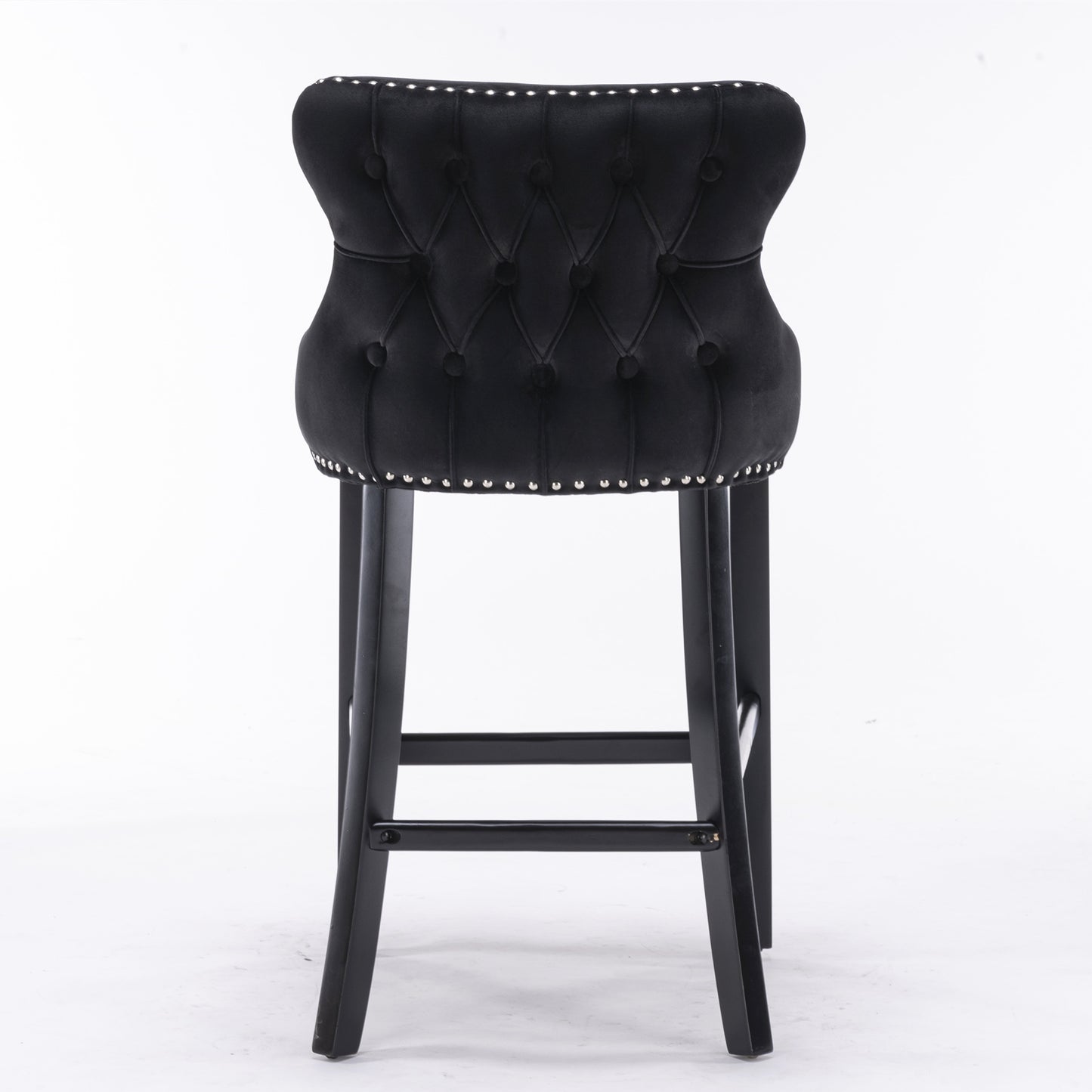 Black velvet bar stool with tufted back and silver nailhead trim