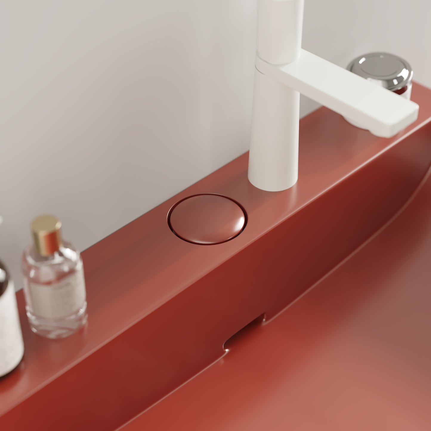 Modern red bathroom sink with white matte faucet and chrome drain
