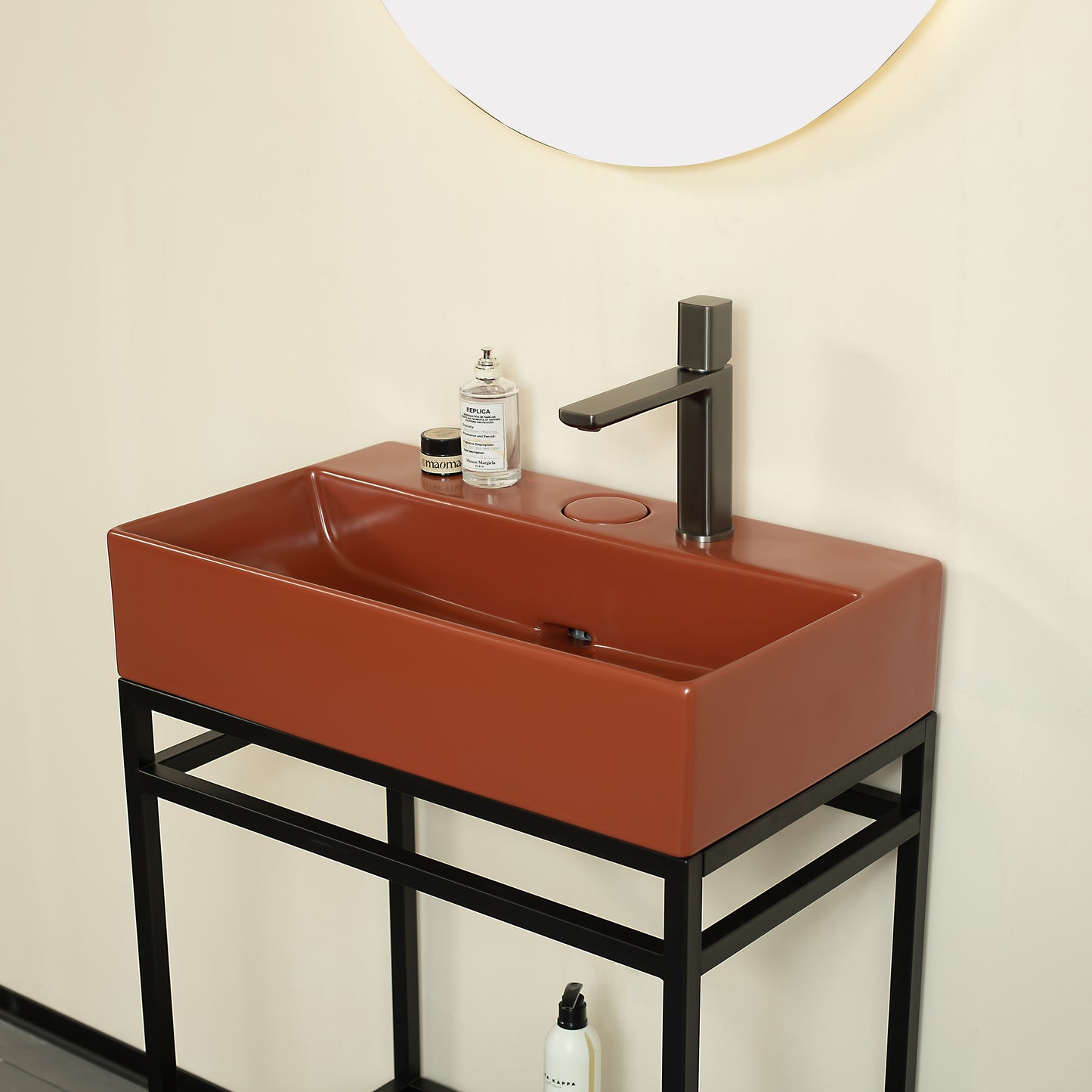 Terracotta rectangular vessel sink with matte black faucet on black metal vanity