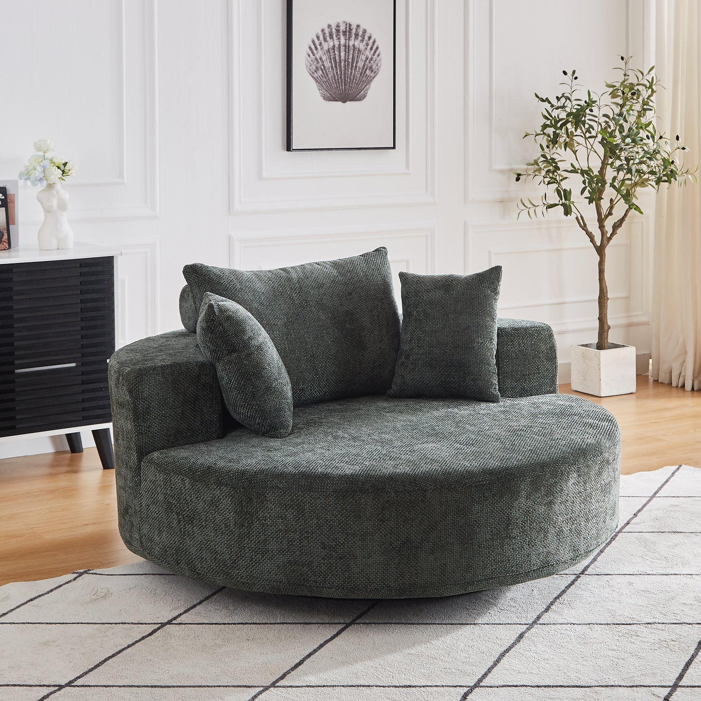 Textured dark grey circular accent chair with matching throw pillows for cozy living room seating