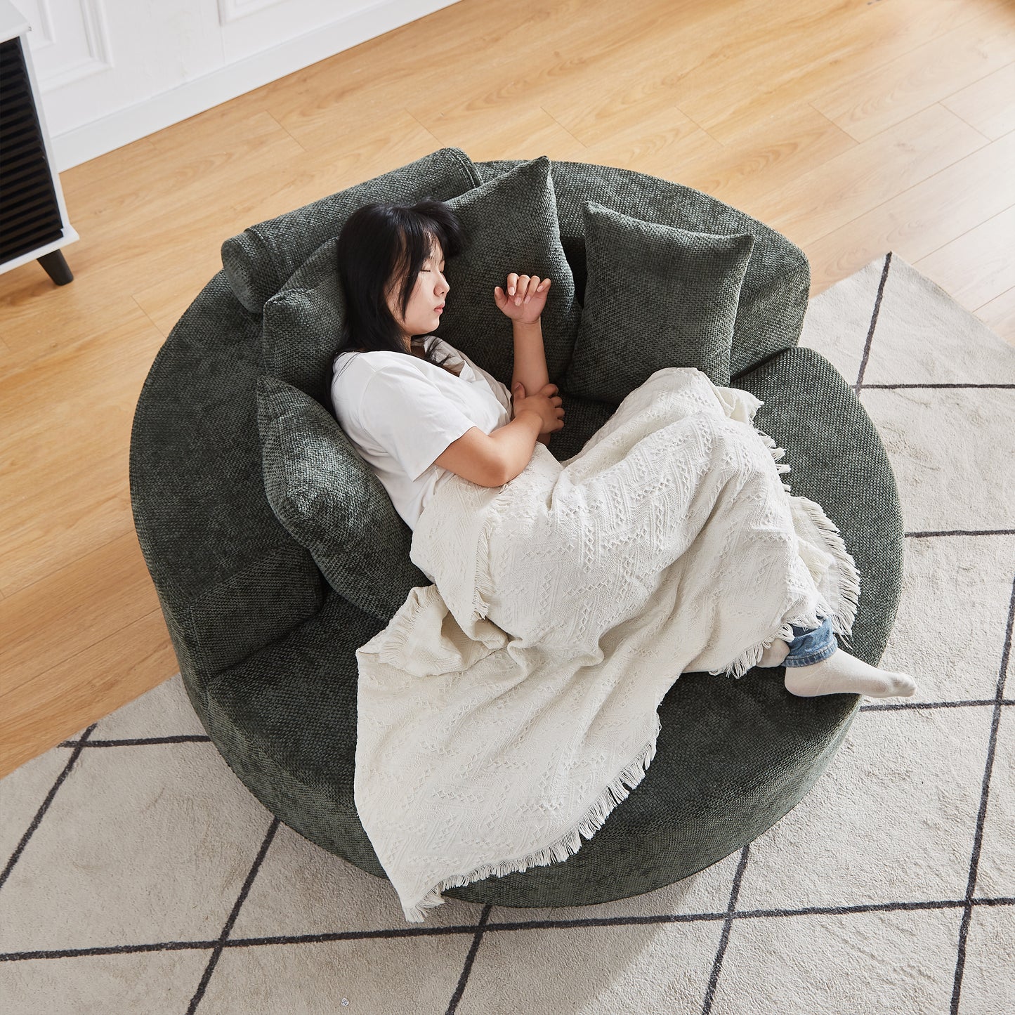 Dark green textured fabric circular sofa with deep seating perfect for lounging