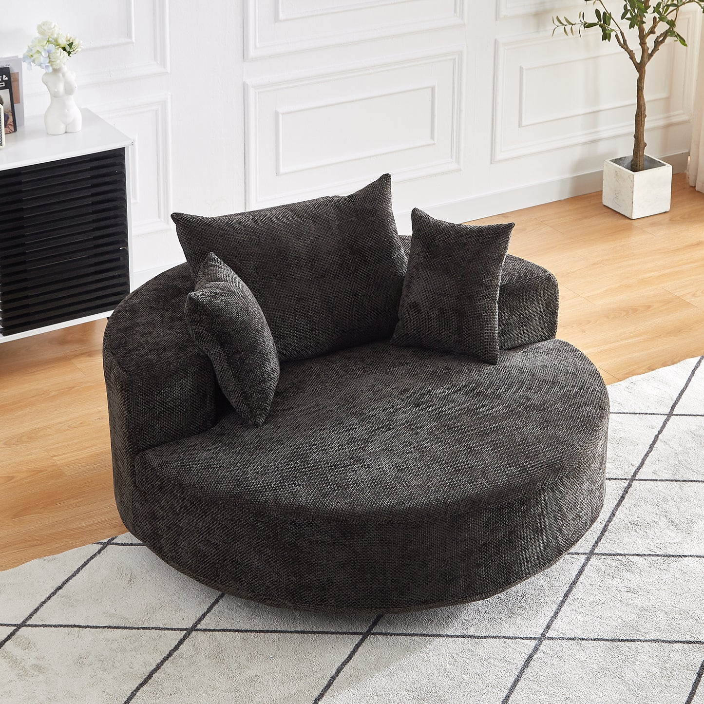 Cozy dark grey fabric circular accent chair with plush cushions perfect for modern living rooms