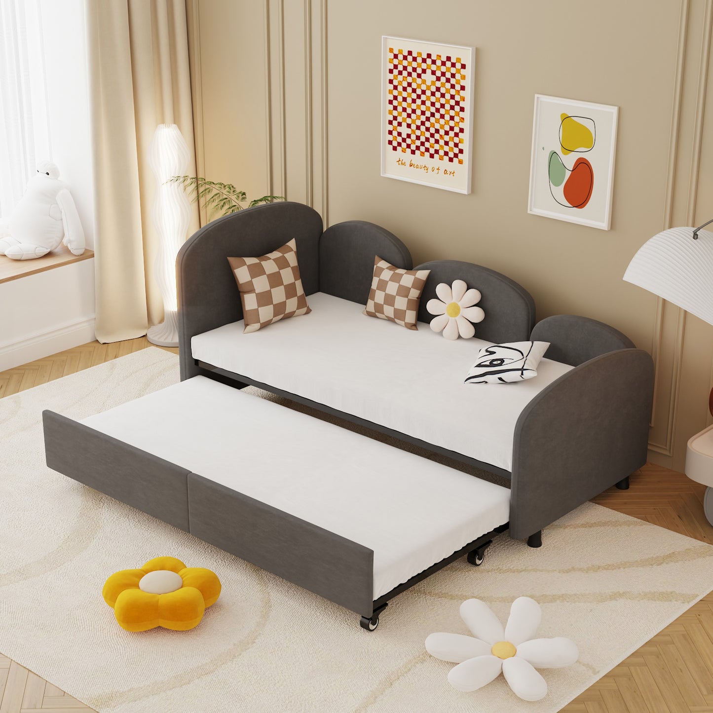 Dark gray upholstered daybed with pullout trundle perfect for kids rooms