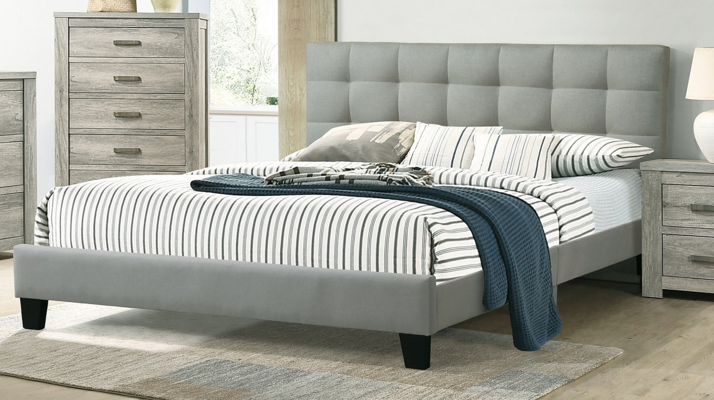 Grey upholstered queen bed frame with tufted headboard and striped bedding