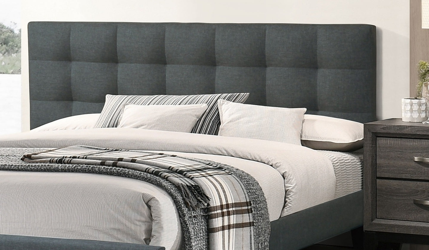 Dark gray upholstered tufted headboard for a queen size bed