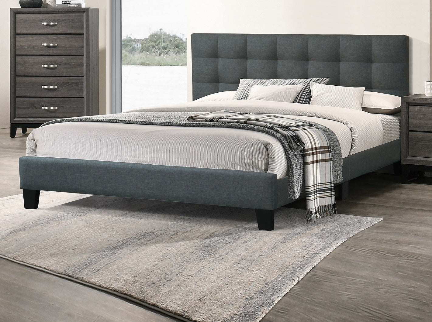 Dark grey upholstered platform bed with tufted headboard and matching frame perfect for modern bedrooms