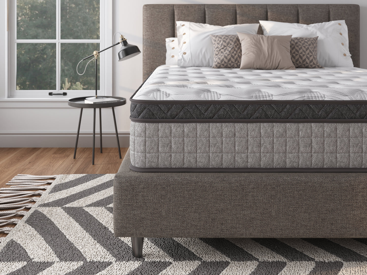 Comfortable grey upholstered mattress with quilted stitching and a modern zigzag pattern