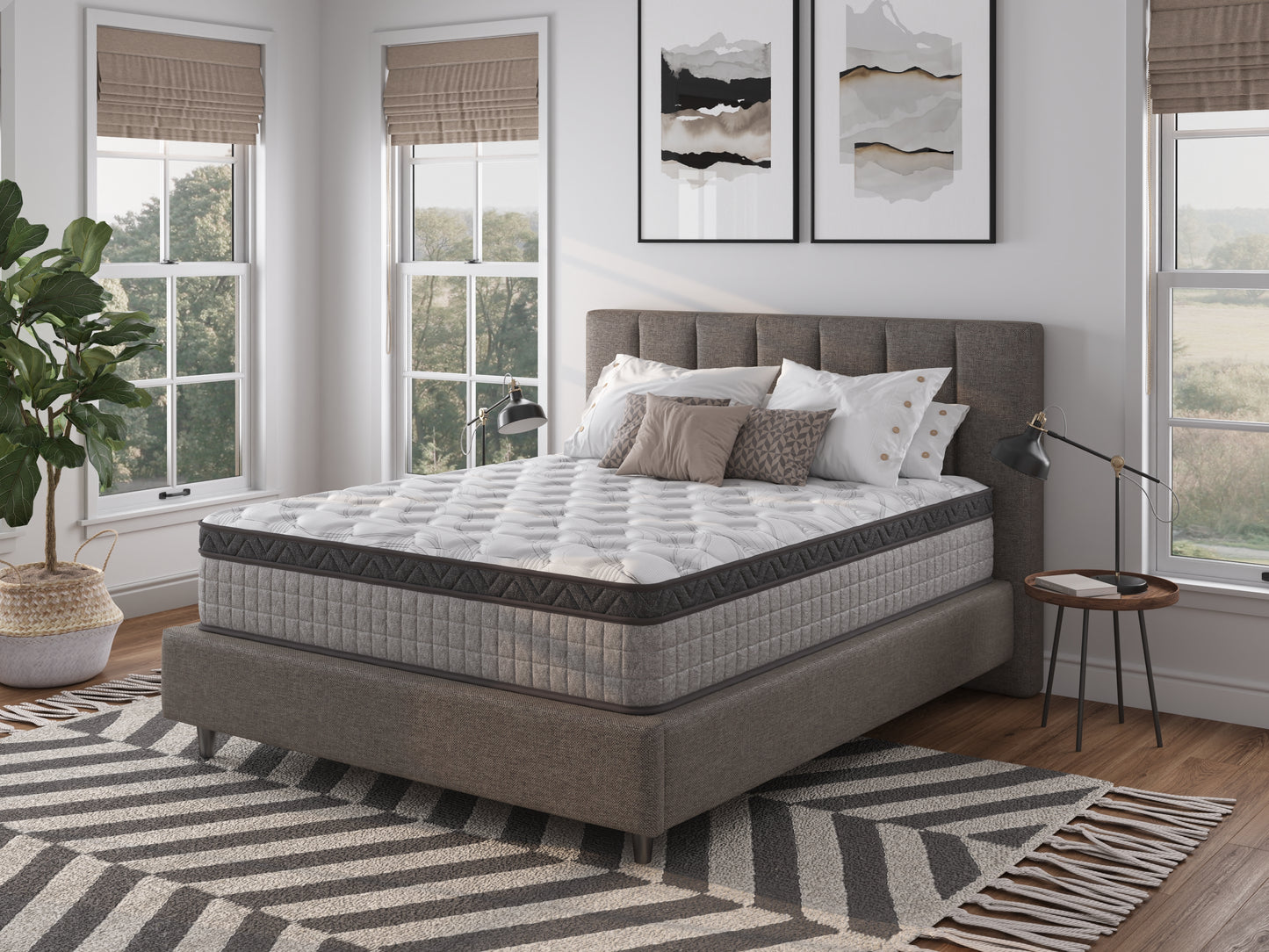 Plush queen mattress with gray geometric quilted sides and a white patterned top for comfortable sleep