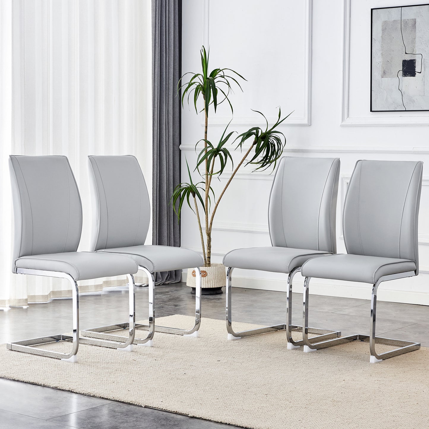 Set of four grey faux leather dining chairs with chrome sled base
