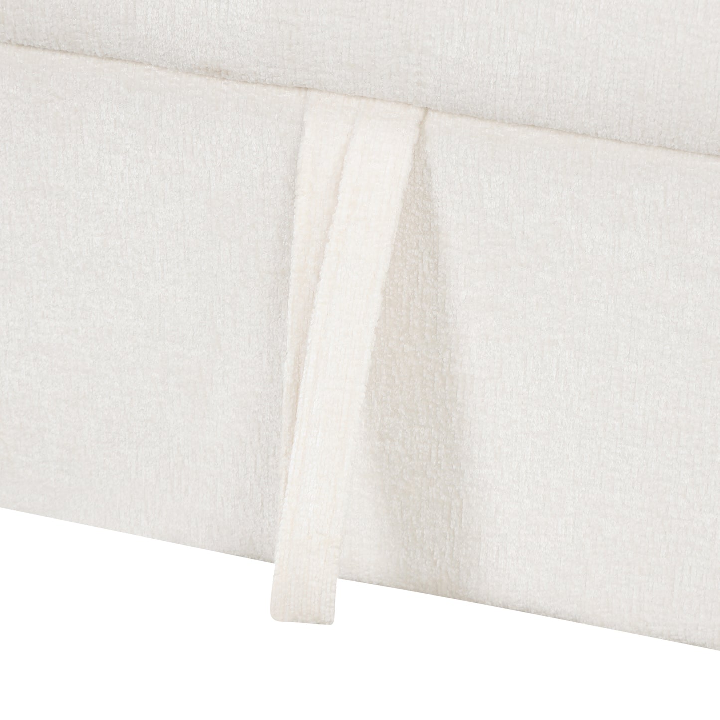 Offwhite boucle textured fabric on a sofa skirt with a handle detail