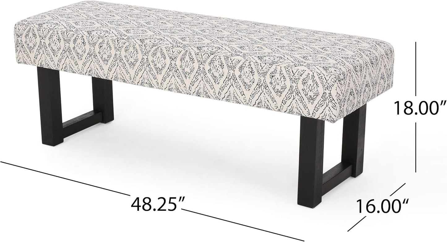 Upholstered bench with geometric pattern fabric and dark wood legs