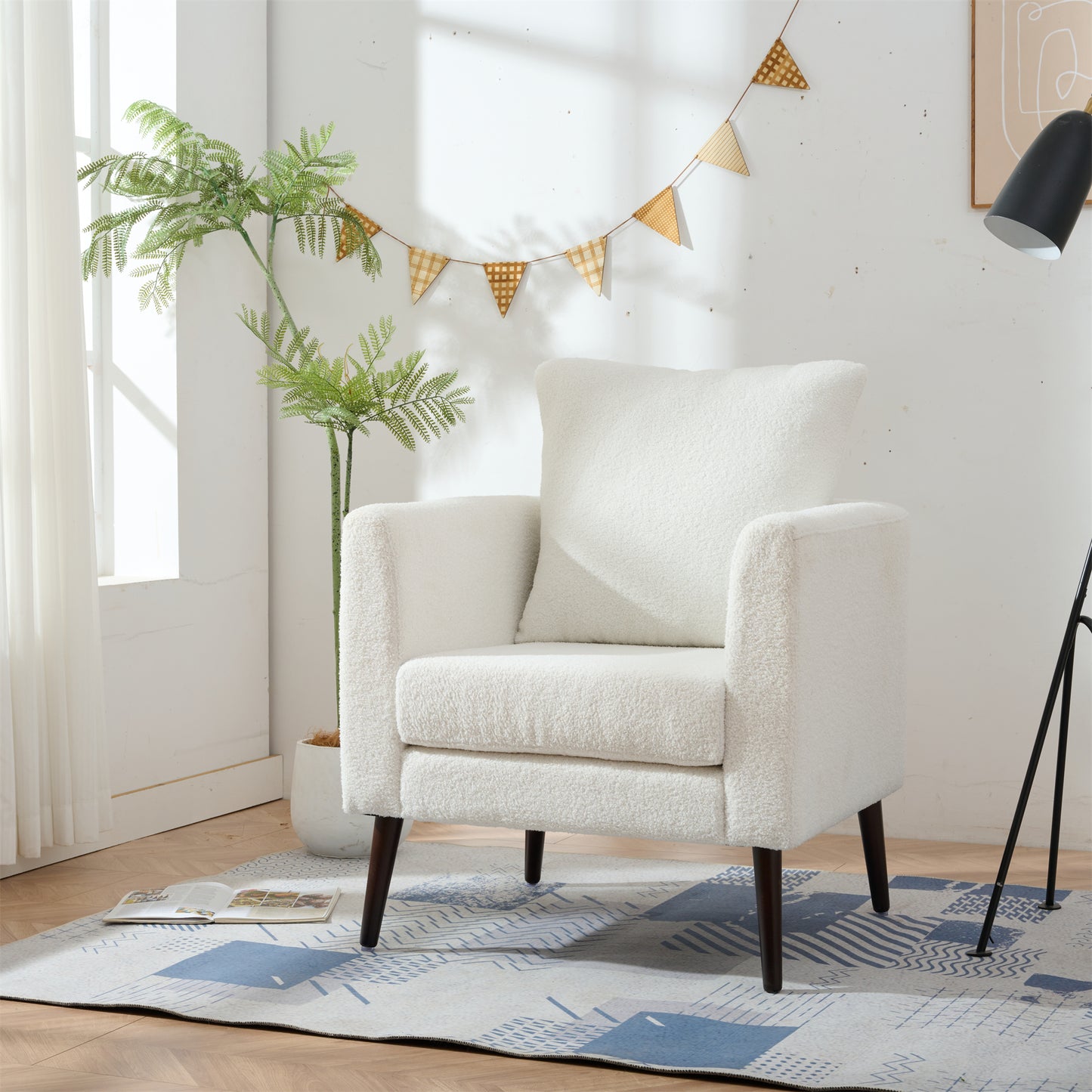 Plush white accent chair with deep seat and comfortable armrests perfect for living rooms