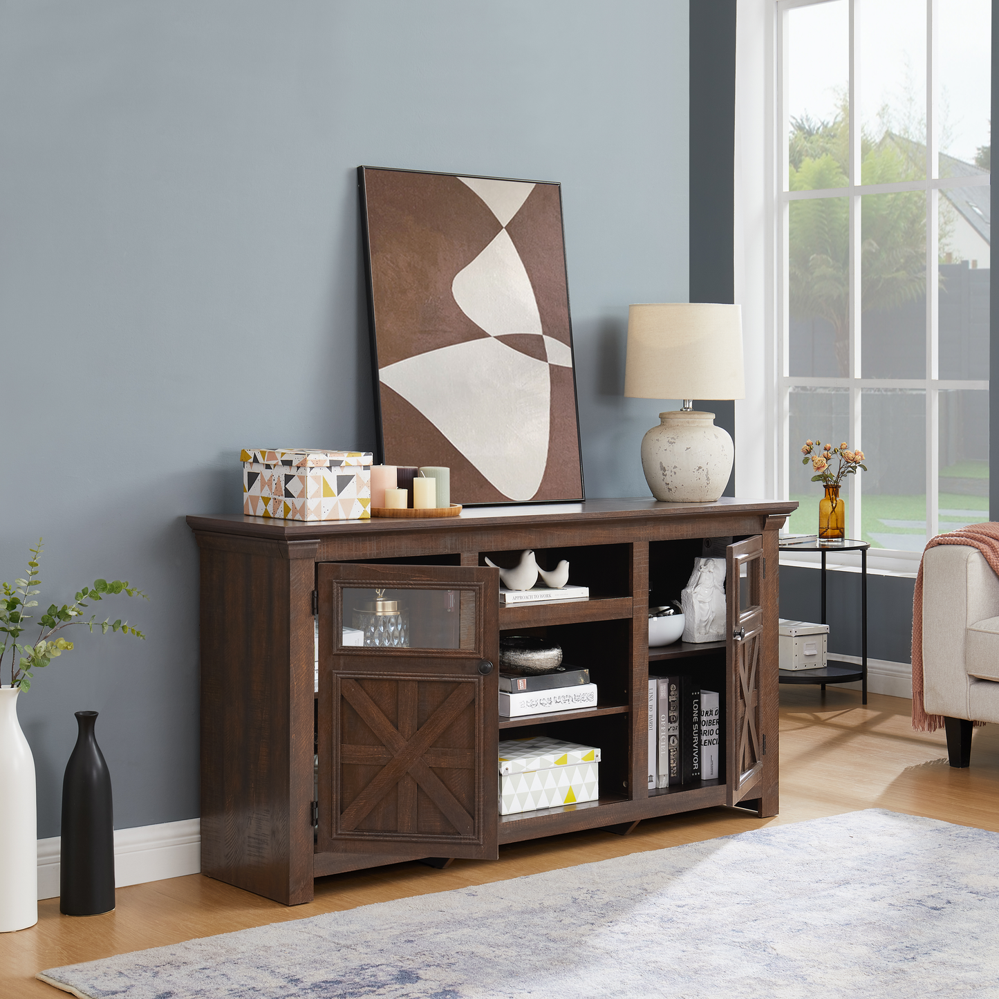 Dark brown wood entertainment center with glass door and open shelves