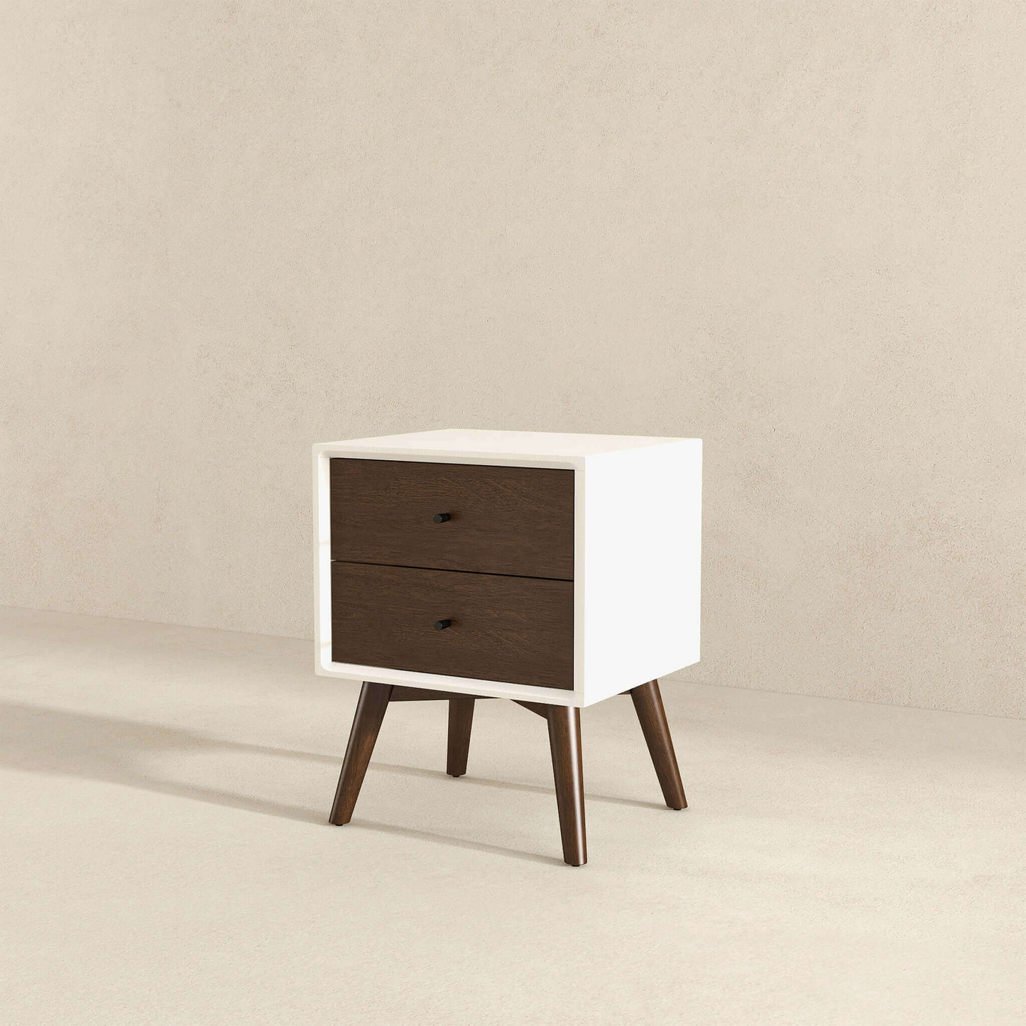White modern nightstand with two dark wood drawers and tapered legs