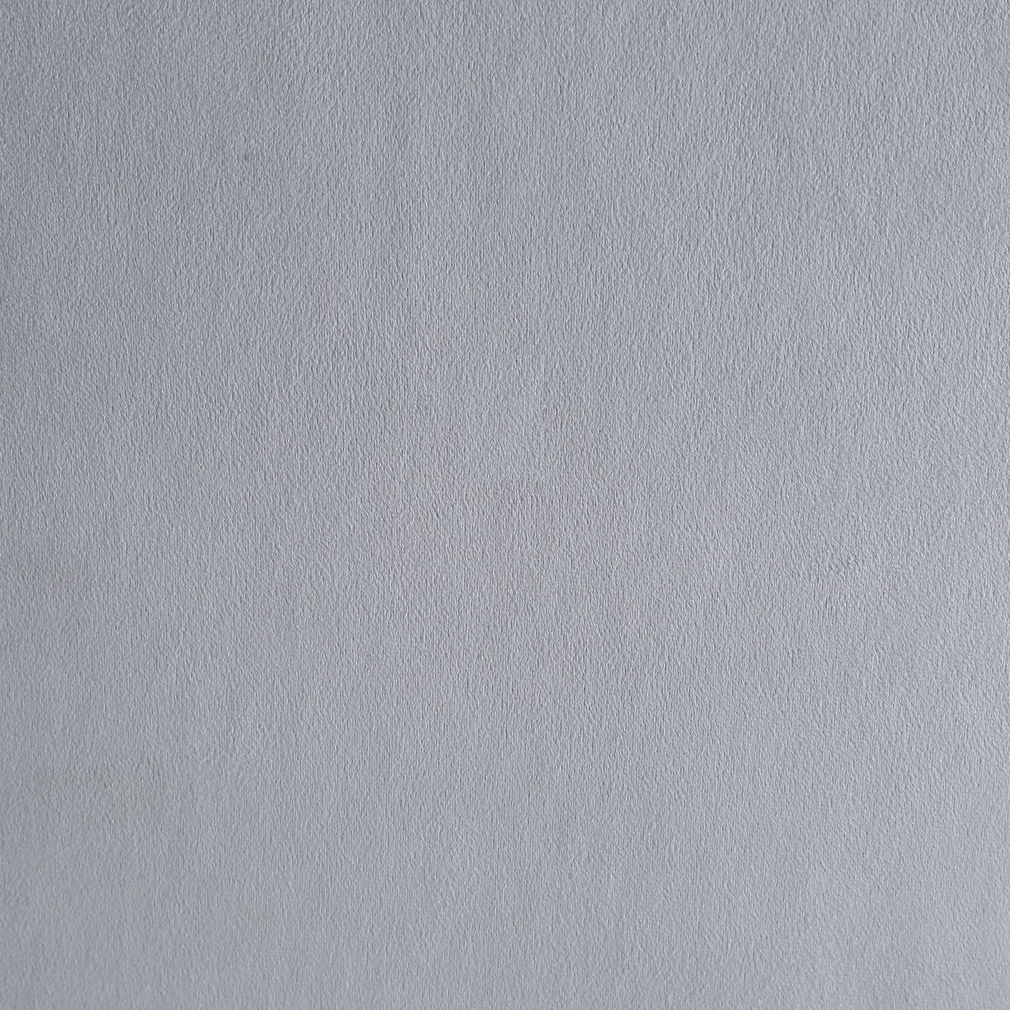 Light grey textured paper background for crafts and art projects