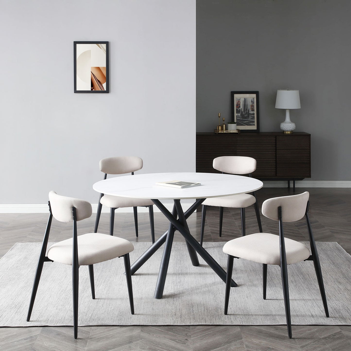 Modern round marble dining table with black metal legs seats four