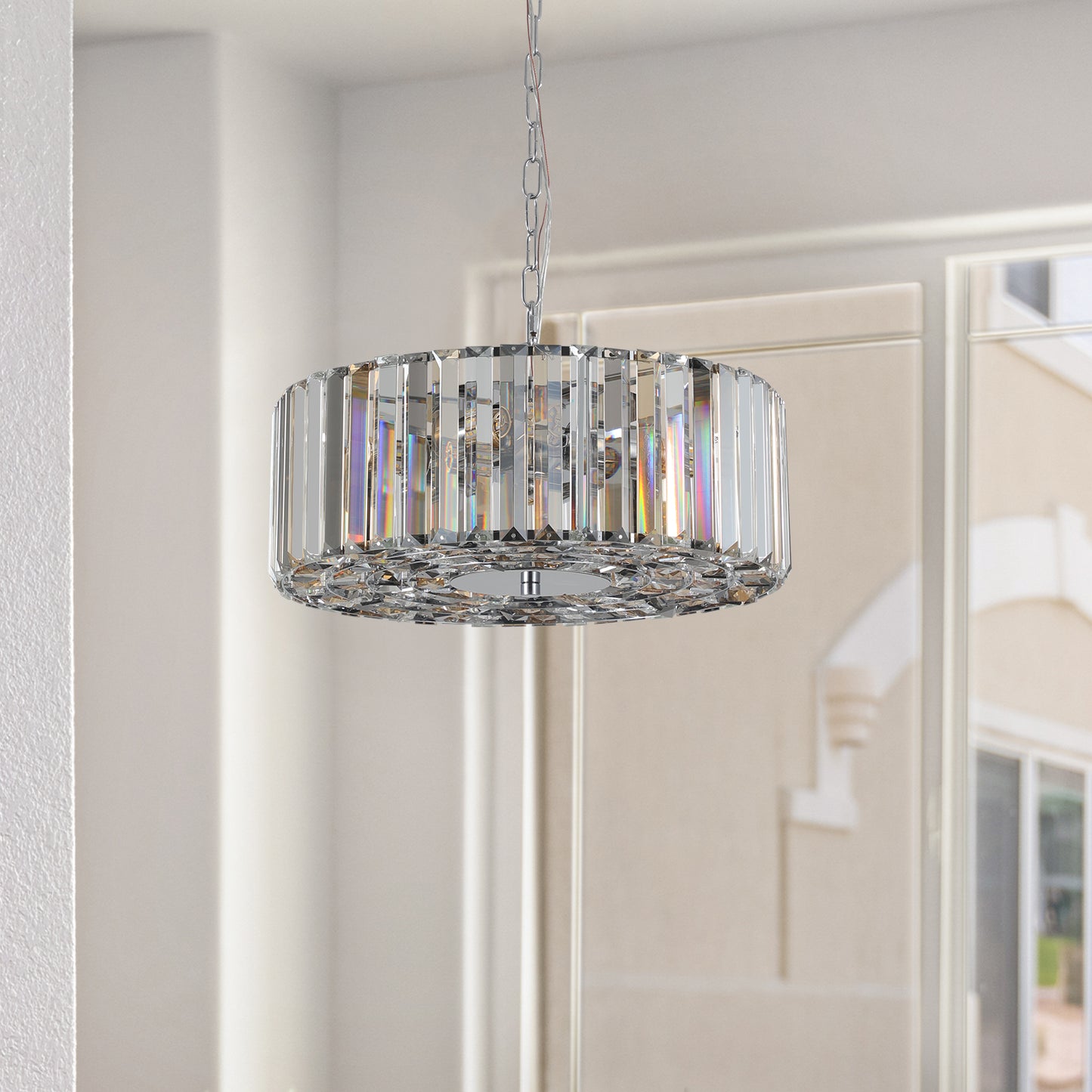 Round crystal pendant light with chrome finish creating a dazzling focal point