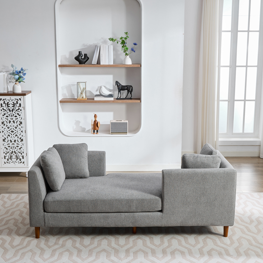 Grey fabric chaise lounge with modern design and plush cushions