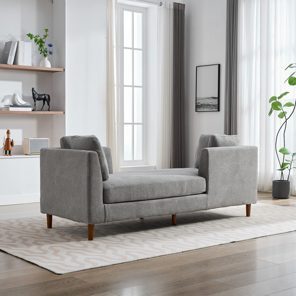 Gray upholstered chaise lounge with wooden legs perfect for modern living rooms