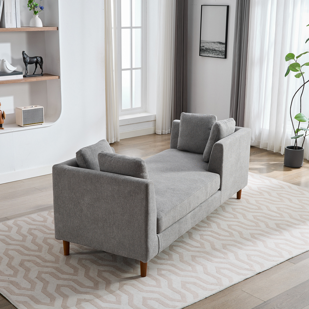 Gray linen fabric sofa with wooden legs and accent pillows for living room comfort