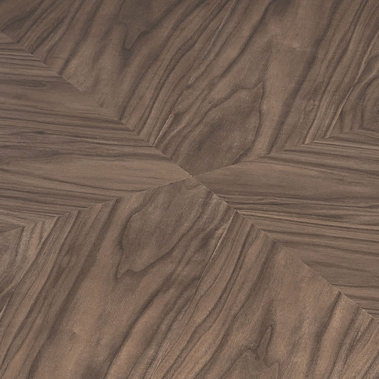 Closeup of dark walnut wood flooring in a chevron pattern showcasing natural grain