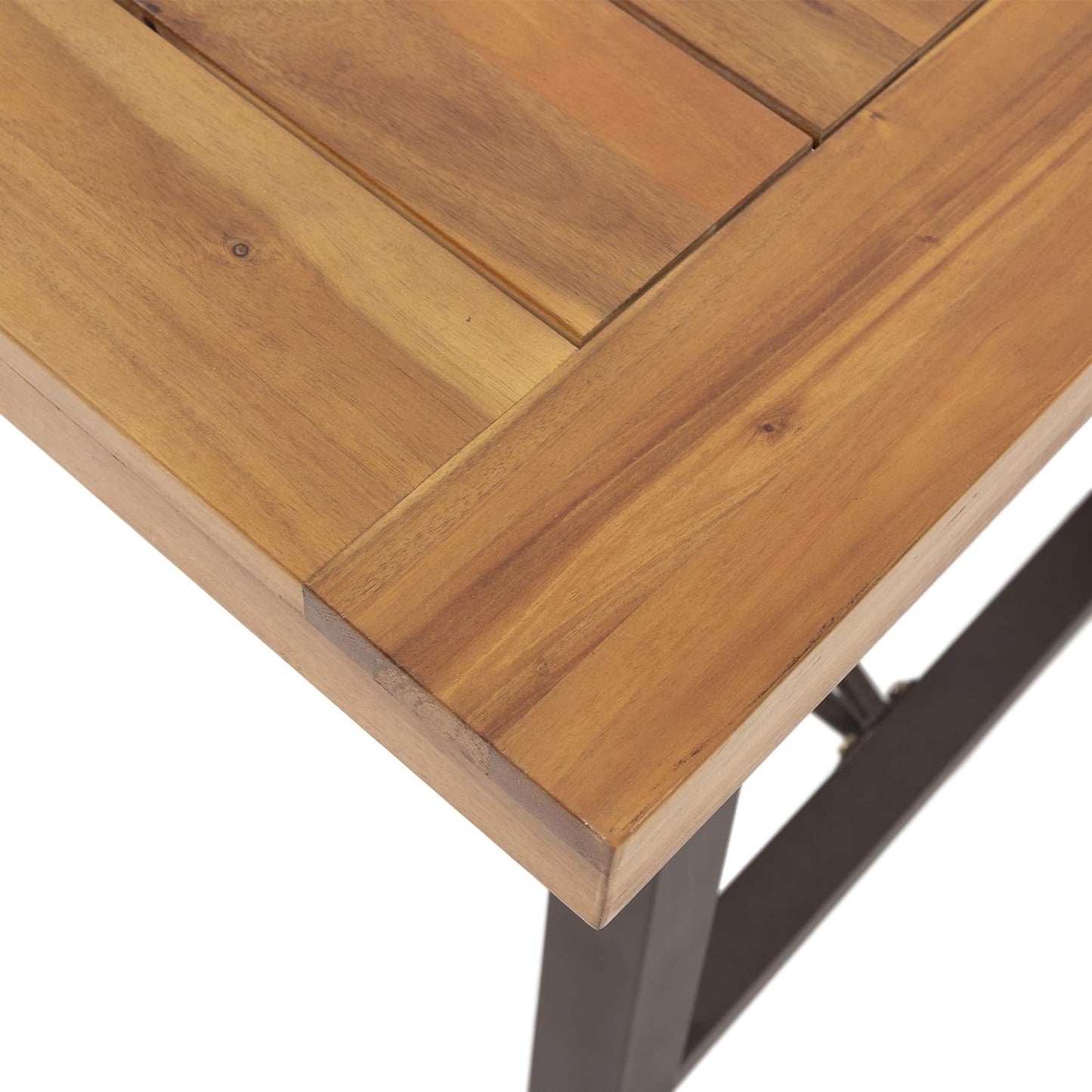 Closeup of a rustic wooden patio table top with slatted design and dark metal legs
